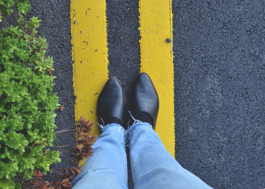 shoes on yellow stripes