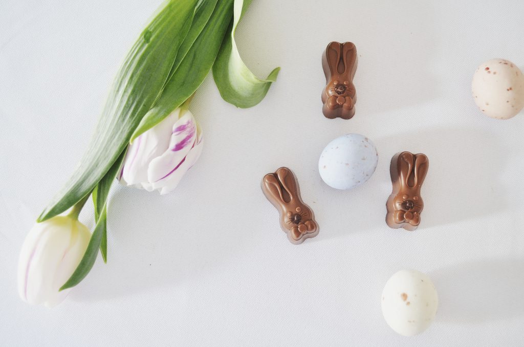 Happy Easter, chocolate bunnies, chocolate eggs, tulips